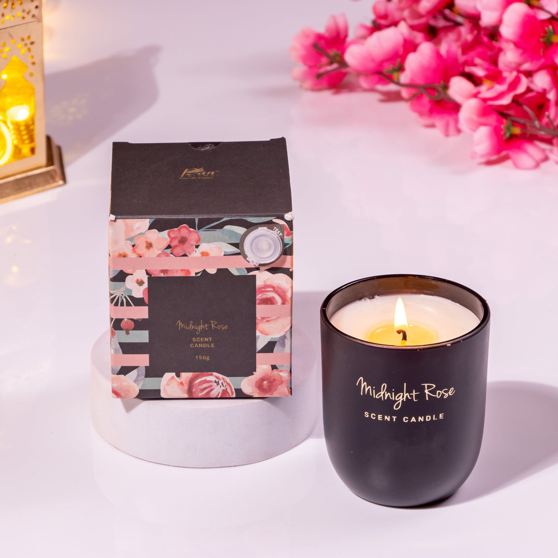 Elegant Midnight Rose scented candle with floral gift box display