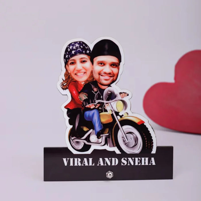 Bunty aur Babli personalized photo caricature in 6x4 acrylic with custom faces on a bike, labeled 'Viral and Sneha'. Ideal for Valentine’s Day gifts.