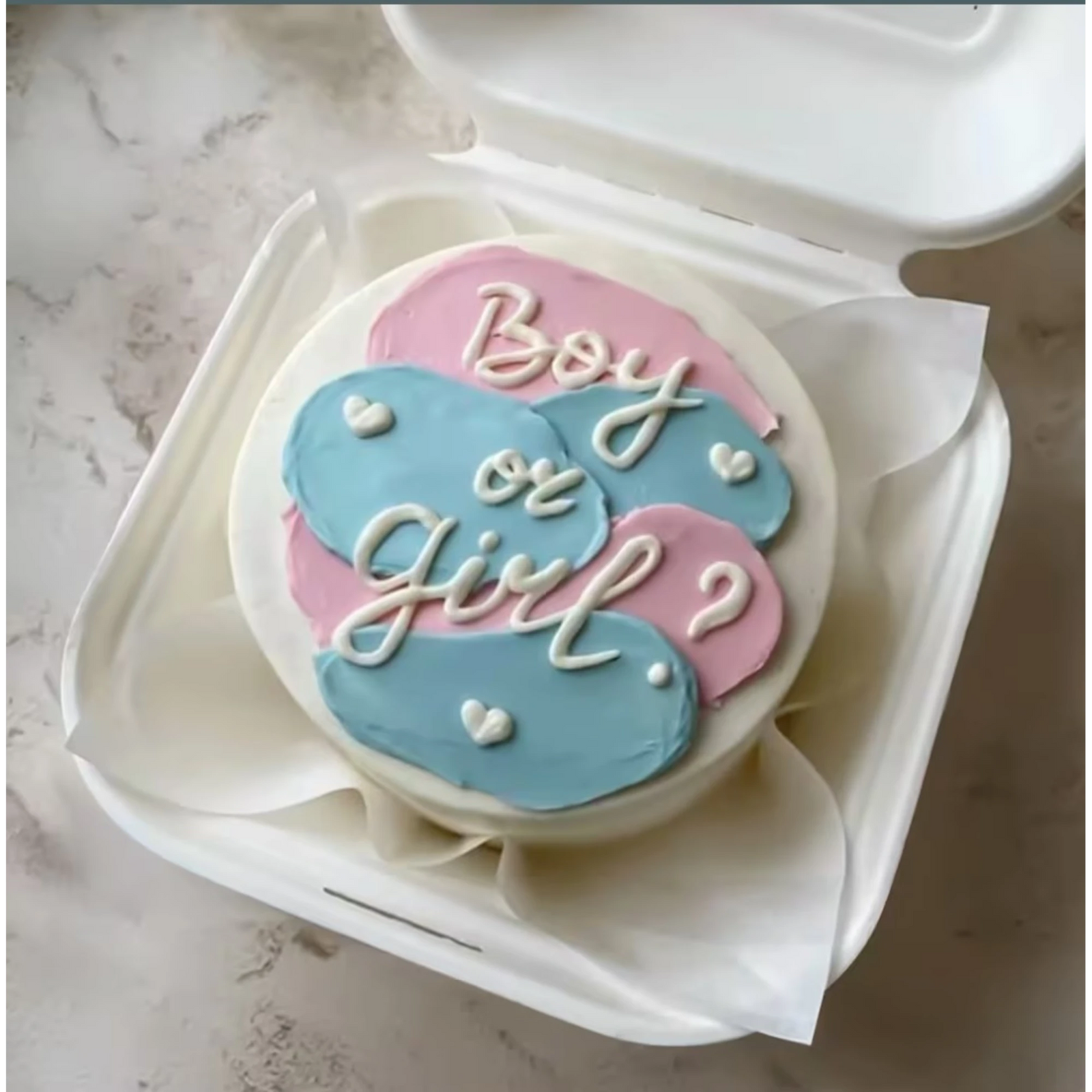 Boy or Girl Mini Surprise Cake with pastel pink and blue icing, decorated with white icing text