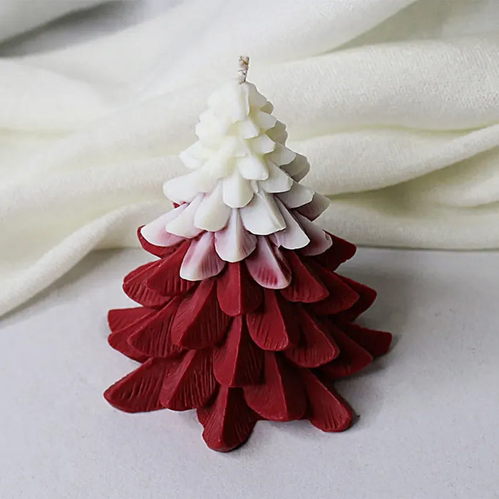 Christmas Tree Scented Candle in red and white with layered pine design, perfect for festive home décor and holiday ambience.