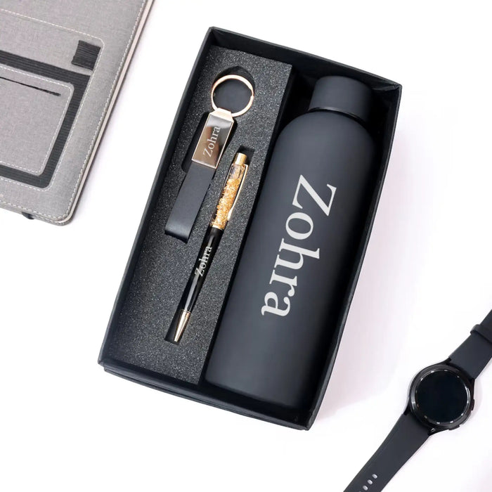Gift set with water bottle, keychain, pen, and watch on a white background
