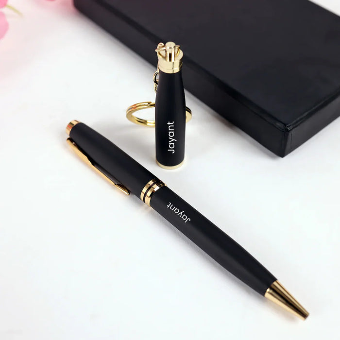 Black pen and lighter set with gold accents on a white background