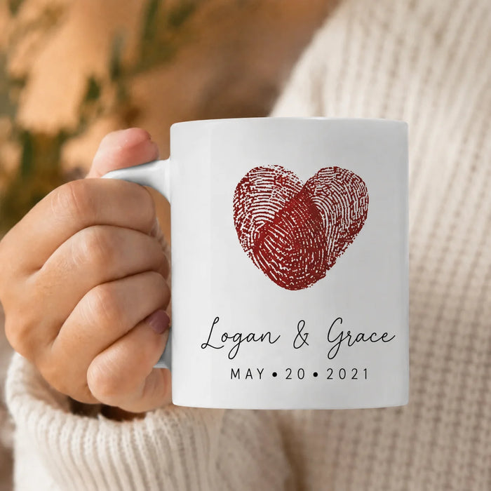 holding in hand fingerprint-heart-couple-mug-personalized-coffee-mugs-with-name