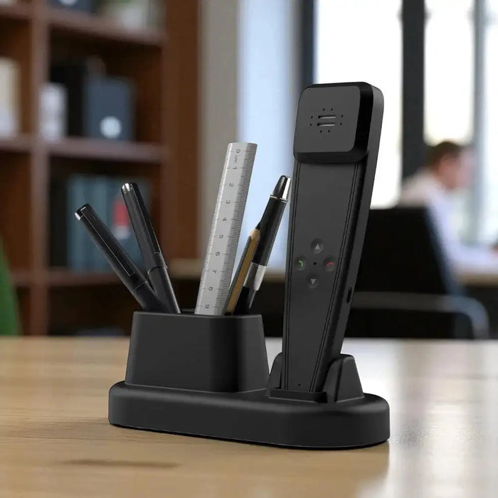 Black desk organizer with pens, a ruler, and a remote control on a wooden surface.